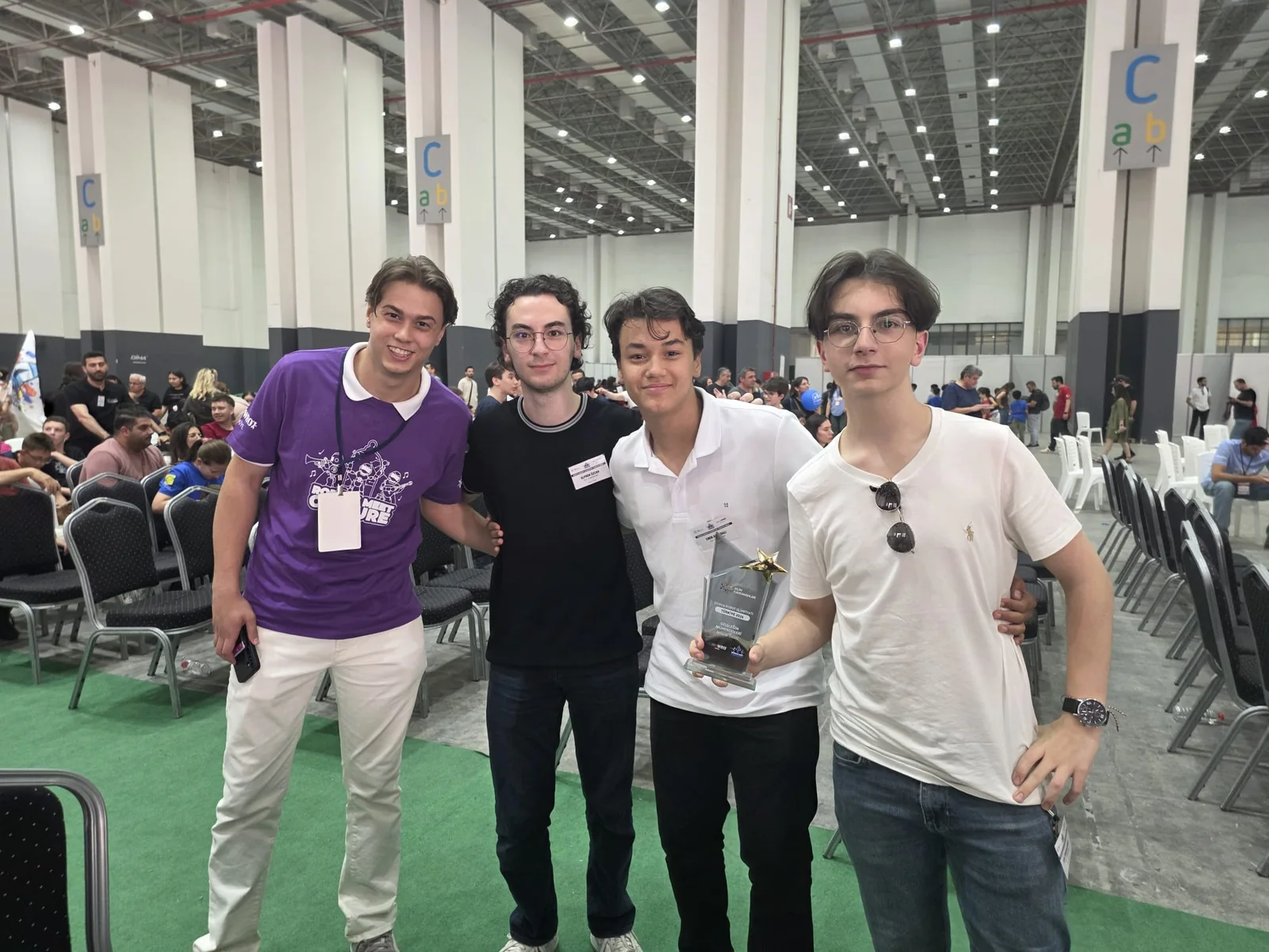 CYBERRCORE at the WRO competition venue with their trophy